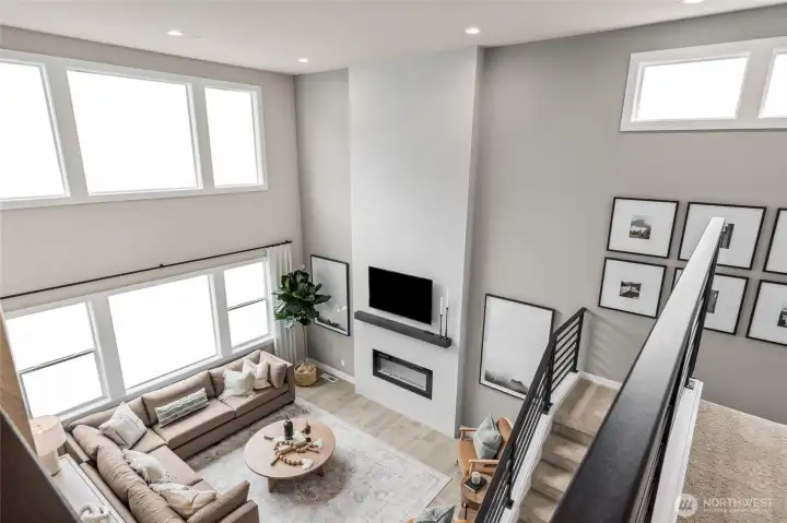 Check out the beautiful, spacious great room with lots of windows. Photo is representational. Actual home is under construction and materials, colors, and finishes will vary. See site agent for details.