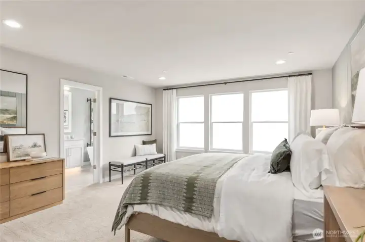 Primary bedroom suite with attached 5-pc bath. Photo is representational. Actual home is under construction and materials, colors, and finishes will vary. See site agent for details.