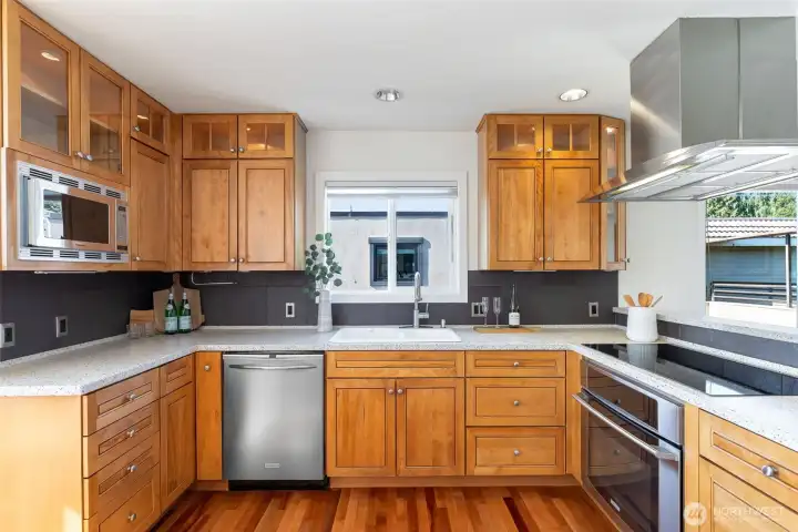 Spacious chef's kitchen with induction cooktop & stainless steel appliances