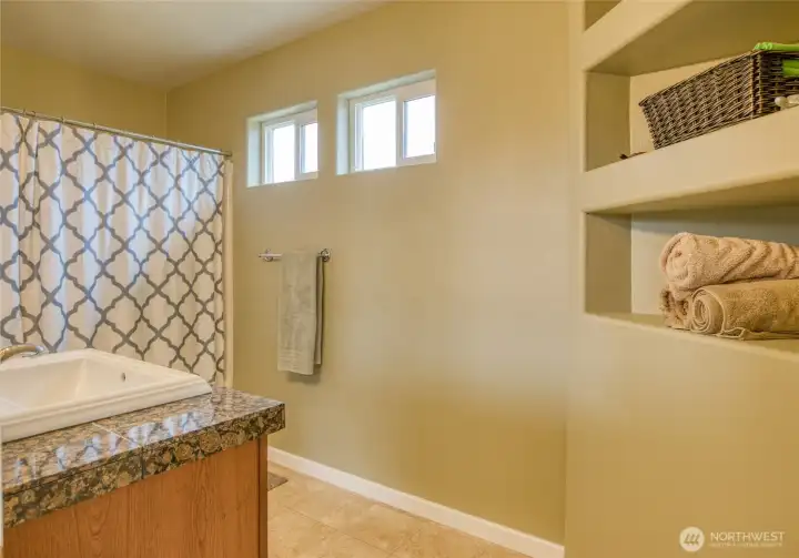 The bathroom has built in storage