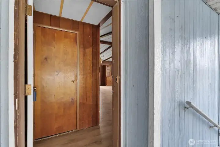 Inviting front entry with coat closet storage.