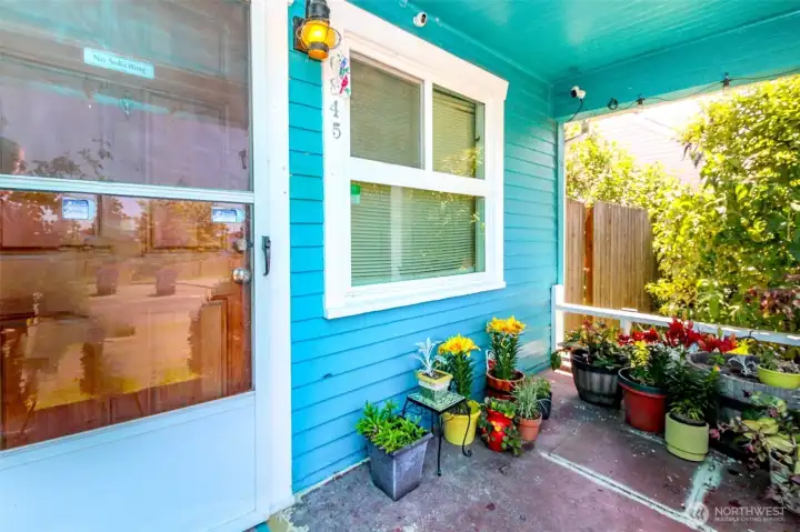 Nice covered front porch which is private on both sides due to the mature landscaping.