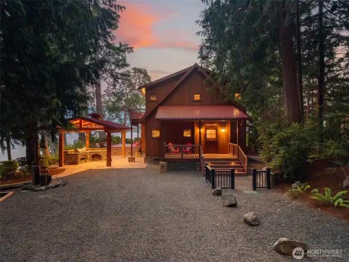 Dusk at Madrona Point. The property glows as warm as it lives.