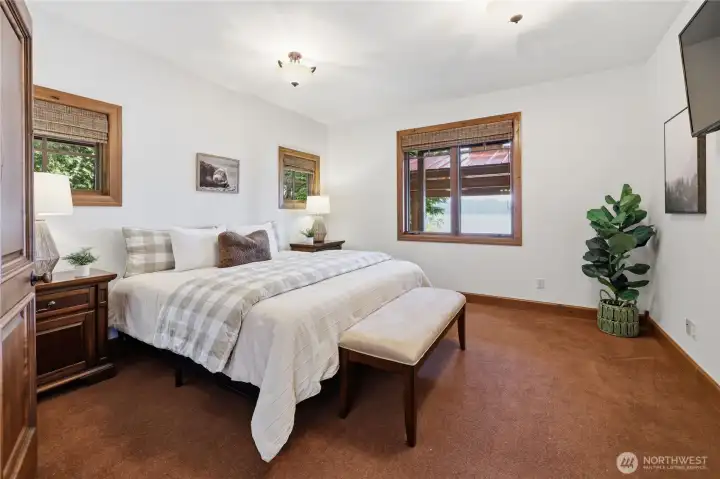 Main floor guest room with water views. Comfortable, private, and steps from everything.