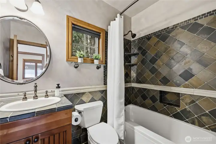 Main floor bath. Slate tile, with tub/shower.