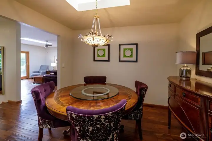 Elegant dining room with tray ceiling, Swarovski crystal chandelier.