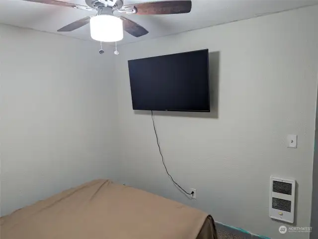 Ceiling mounted lighting with fan.