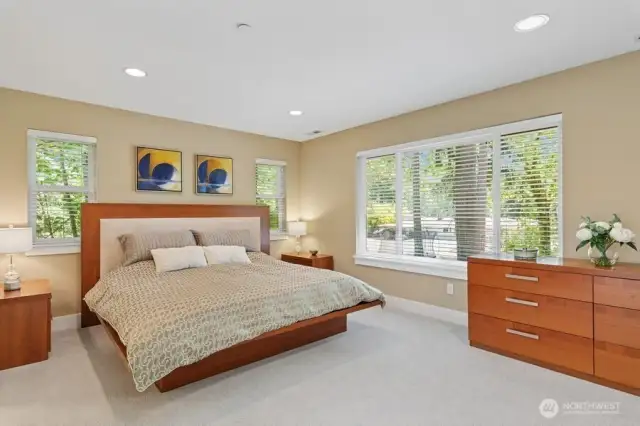 Upstairs boasts primary suite with 5-piece bath, large custom California organizer in the walk-in closet.