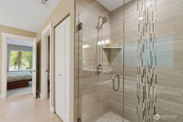 Luxurious primary suite with 5-piece bath located upstairs. Private room for toilet