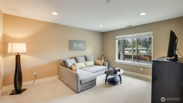 Perfect for relaxing or playing in this spacious upstairs rec room with double door entry, large window, newer top of the line carpet.  Sprinkler system throughout home.