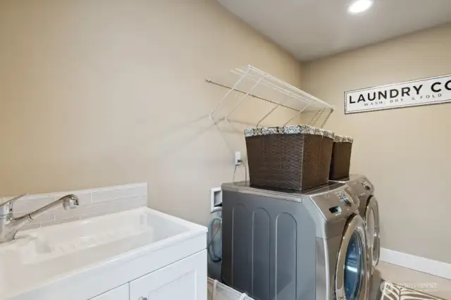 Upstairs laundry room, washer & dryer stay with the house.
