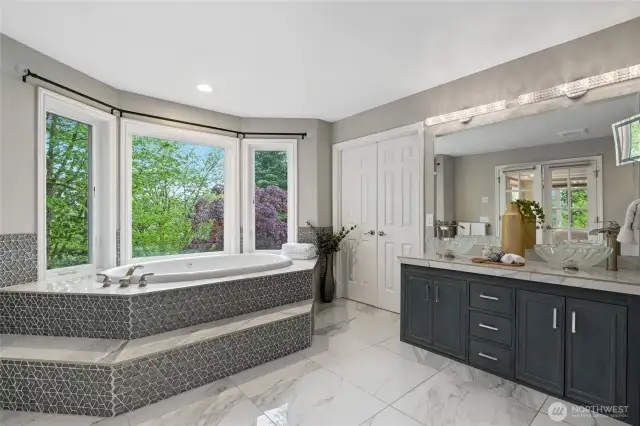 Jetted tub, marble floors and designer touches throughout. Double door access to spacious walk in closet, big enough for His and Hers together