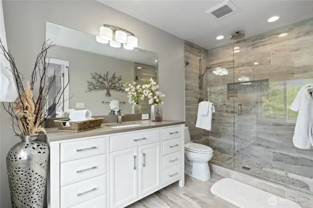 Guest Bath with tile shower and stone countertop