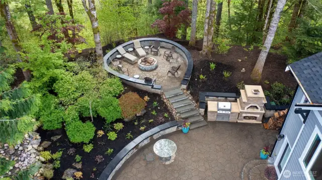 AN aerial view of the Barbeque/Pizza Oven and round Fire pit patio.