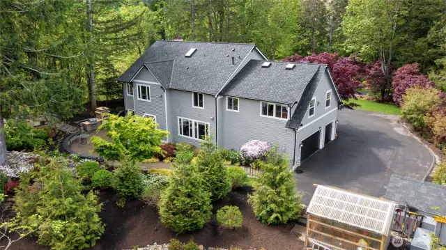 Back Elevation with green house to grow your own vegetables along with spacious extended side drive
