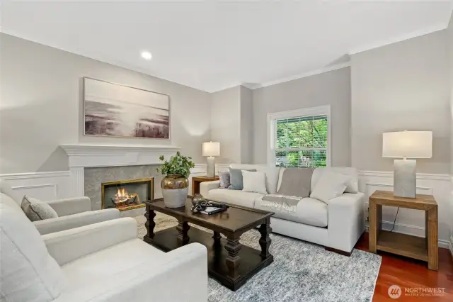 Formal Living Room with gas fireplace surrounded by marble