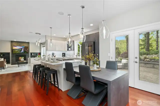 Another view of the Kitchen with eating table incorporated. Family room beyond.