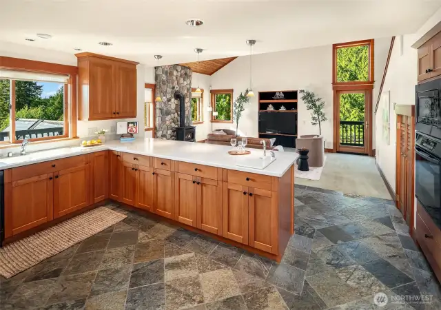 Kitchen and Family rooms are spacious and welcoming with light streaming in. Plenty of seating at the bar.