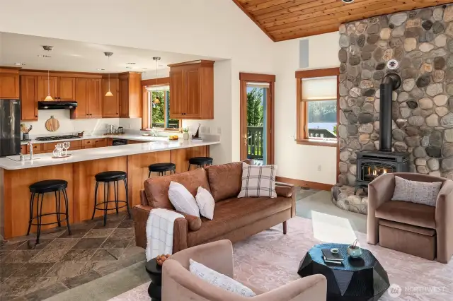 Stone hearth with propane heat stove creates a cozy atmosphere in the family room. So many options for entertaining in this beautiful home.