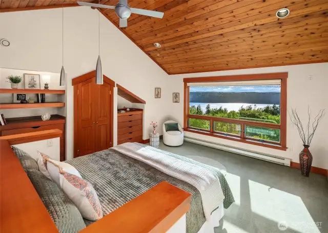 Primary suite with its own stair to family room. Lovely sound and mountain views from this room.