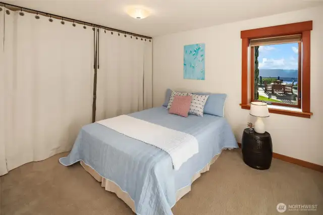 Lower level bedroom with 3/4 bath opposite.
