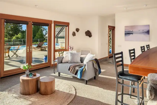 Lower level game room with direct access to pool patio for more entertaining options. Wet bar, wine cellar, dressing area and hearth are all within reach!