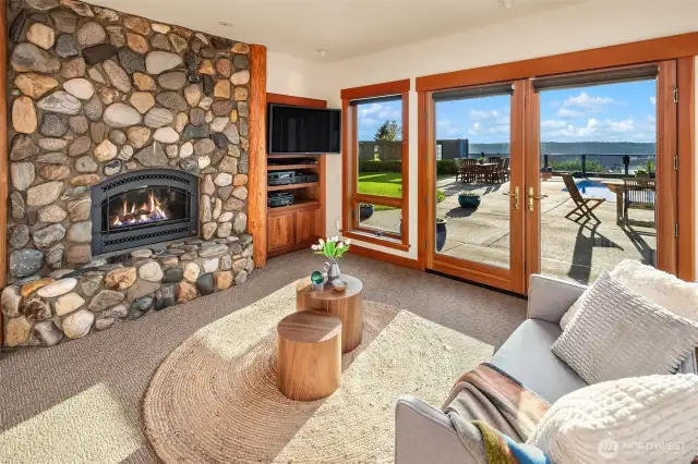 Stone hearth, propane insert, french doors and more custom details.