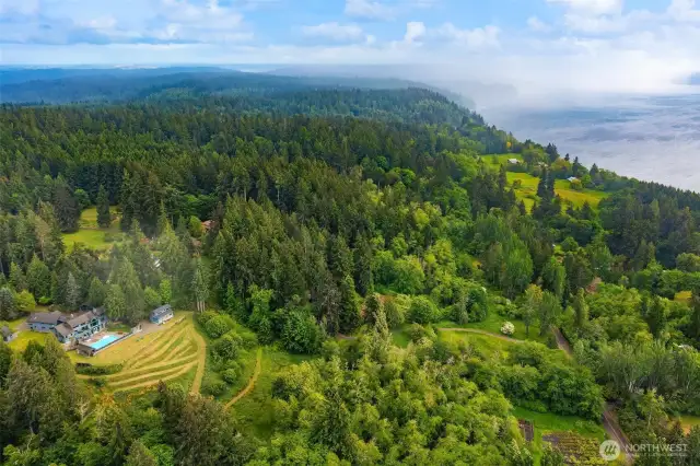 Situated on a beautiful island in central Puget Sound, there is a story-book property that can be yours...