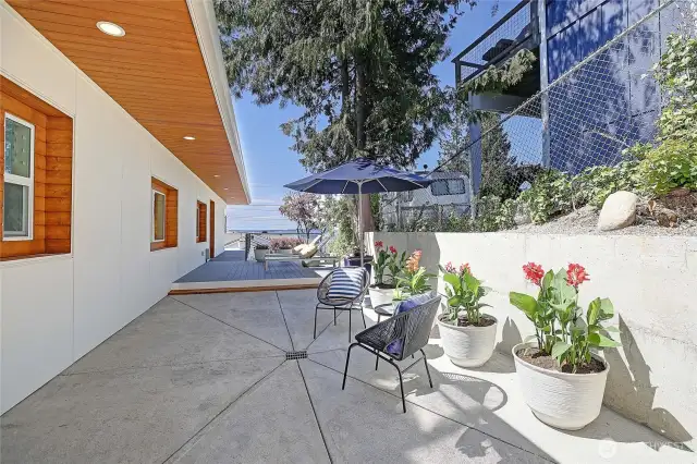 Hardscaped side of home fully usable for grilling, relaxing. Has water views!