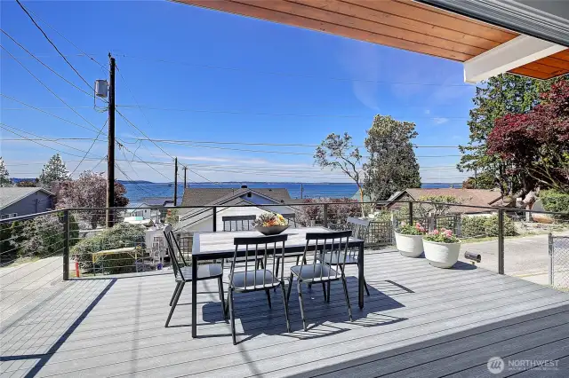 Indoor/outdoor living at it's best, deck off kitchen in front of home.