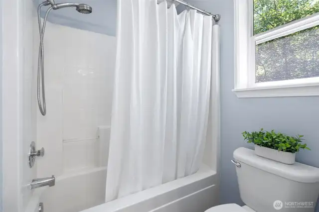 Primary bedroom suite upstairs with full bath and walk in closet.