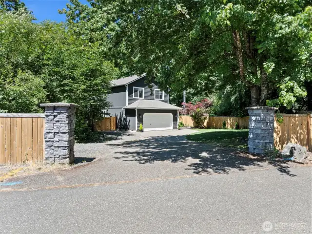 Property entrance via driveway off 55th Ave Ct NW.