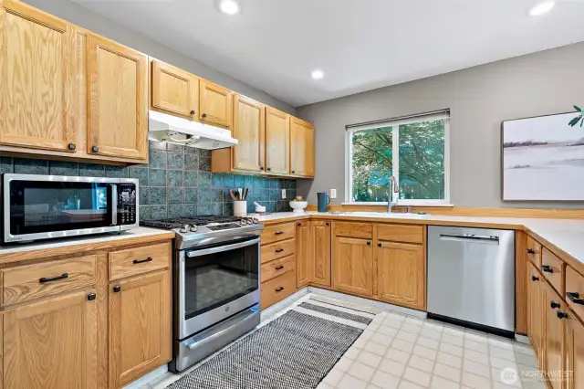 with gas stove and stainless appliances