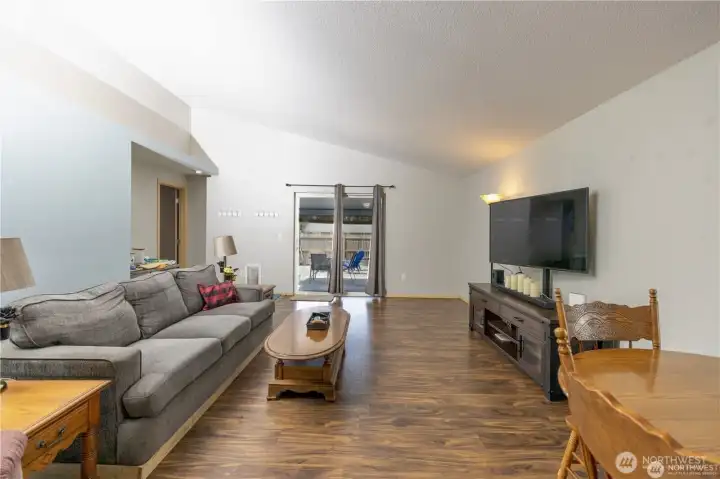 Living room with door to covered patio