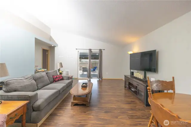 Living room with sliding door to covered patio