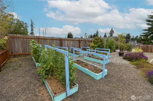 This home comes with a thriving vegetable garden and tons of fruit trees!