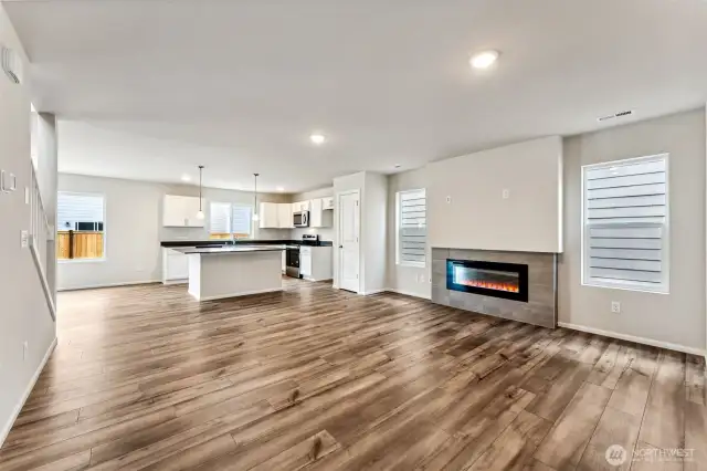Open Concept living/Dining/Kitchen-Disclaimer- Photos are from a similar floor plan from another community, photos are for illustrative purposes only. Finishes, flooring, features, upgrades, countertops, paint, colors, and other features may vary. Disclaimer- Photos are from a similar floor plan from another community, photos are for illustrative purposes only. Finishes, flooring, features, upgrades, countertops, paint, colors, and other features may vary.