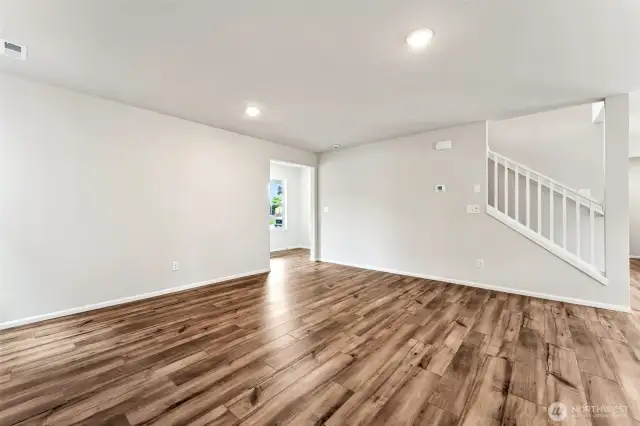 Open Concept living/Dining/Kitchen-Disclaimer- Photos are from a similar floor plan from another community, photos are for illustrative purposes only. Finishes, flooring, features, upgrades, countertops, paint, colors, and other features may vary.