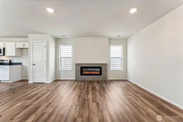 Open Concept living/Dining/Kitchen-Disclaimer- Photos are from a similar floor plan from another community, photos are for illustrative purposes only. Finishes, flooring, features, upgrades, countertops, paint, colors, and other features may vary.