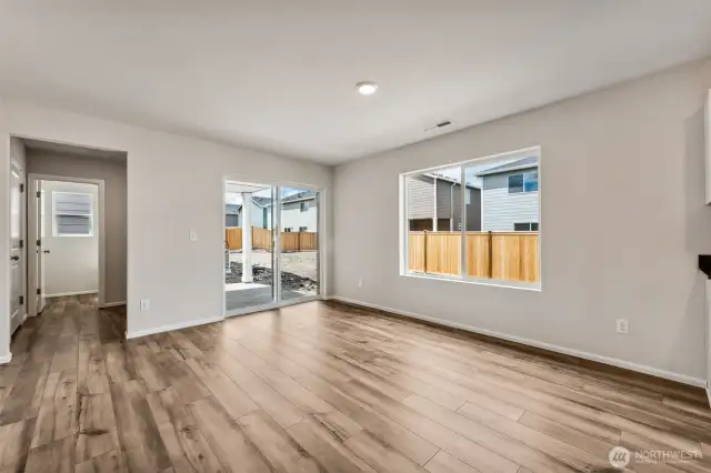 Open Concept living/Dining/Kitchen-Disclaimer- Photos are from a similar floor plan from another community, photos are for illustrative purposes only. Finishes, flooring, features, upgrades, countertops, paint, colors, and other features may vary.