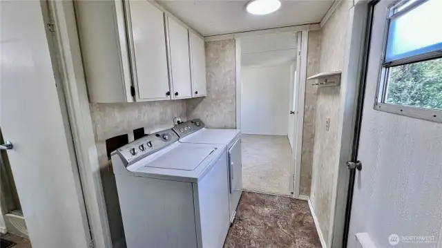 Utility Room W/ Washer and Dryer