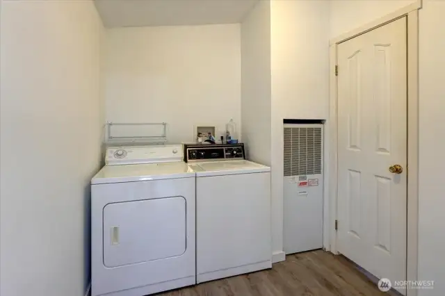 Utility room includes the washer and dryer.