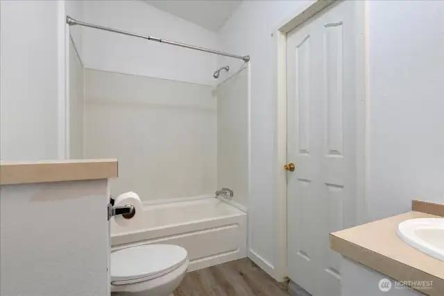 Full main bath off the hall. Door accesses the utility room.