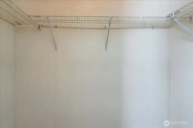 Primary bedrooms' large walk-in closet.