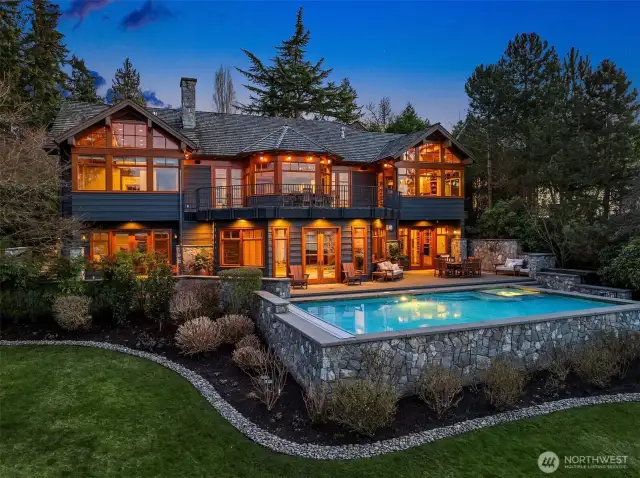 Welcome to an exquisite waterfront estate where timeless elegance meets modern luxury. Custom built with extraordinary craftsmanship and meticulous attention to detail, this peaceful retreat offers breathtaking panoramic views and an unrivaled waterfront lifestyle.