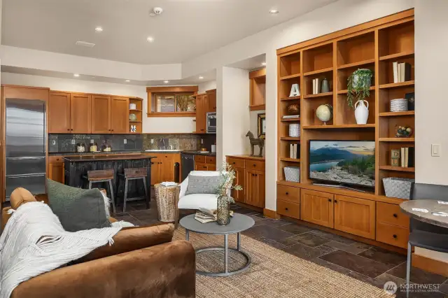 Lower level second kitchen perfect for entertaining poolside. The slate flooring is ideal for coming in from the lake or pool. Plus 2 beach bathrooms just down the hall.