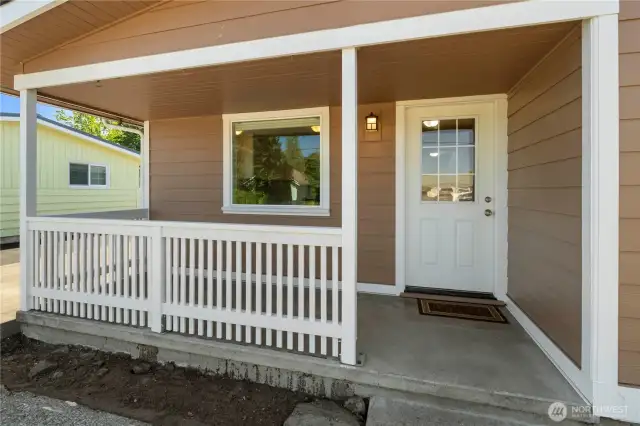 Eye-hooks are ready for your favorite floral baskets and enjoy the charm of this welcoming front porch!