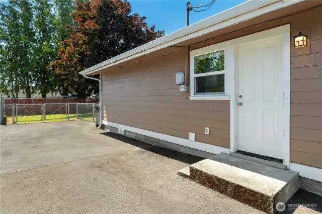 Exterior side door into utility/mudroom
