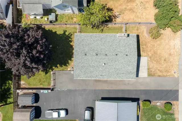 Long driveway, large front yard, and fully fenced backyard