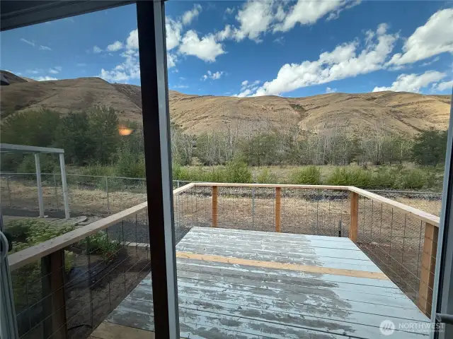 sliding door open to porch and sounds of the river